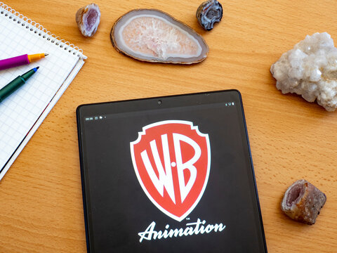 In This Photo Illustration Warner Brothers Animation Logo Seen Displayed On A Tablet