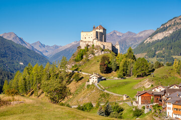 Mountains surrounding the majestic Castle of Tarasp (Grisons, Switzerland). It lies in the Lower Engadine Valley along the Inn River near Scuol. Tarasp Castle was built in the 11th century.