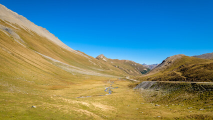Obraz premium Looking at the Swiss Albula Pass in September. It is one of the three paved road passes connecting the Engadin with the northern Grisons, together with the the Julier Pass and the Flüela Pass. 