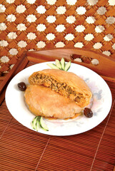 Bastila traditional Moroccan dish, pie filled with chicken, eggs, onions, sugar, almond, pigeon meat, fish. Moroccan specialties