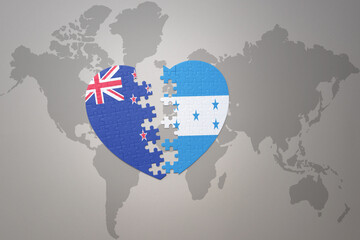 puzzle heart with the national flag of new zealand and honduras on a world map background. Concept.