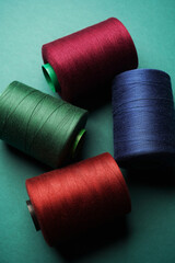 Colorful thread spool background, close-up