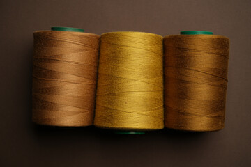 Colorful thread spool background, close-up