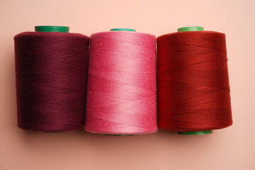Colorful thread spool background, close-up
