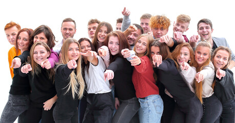 large group of casual young people pointing ahead