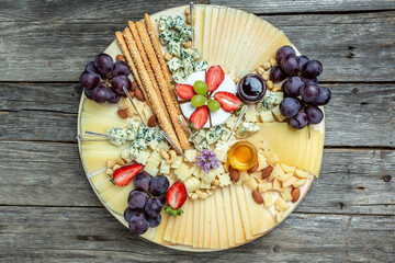 Antipasto platter, Antipasto Cheese board of various types of soft and hard cheese. spanish manchego cheese, aperitivo party concept, banner, menu, recipe place for text