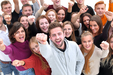 close up. confident guy standing among his friends