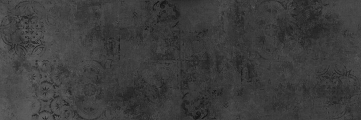 Fototapeta na wymiar Old black anthracite gray grey vintage worn geometric arabesque shabby mosaic ornate patchwork motif porcelain stoneware tiles stone concrete cement wall texture background panorama