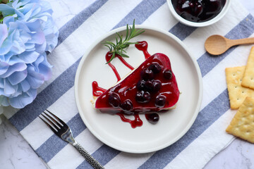 Blueberry cheese pie in white plate  garnish with rosemary and some ingredients  at top view 