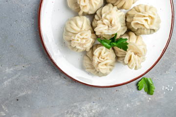 Georgian dumplings Khinkali with meat and spicy sauce. banner, menu, recipe place for text, top view