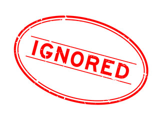 Grunge red ignored word oval rubber seal stamp on white background