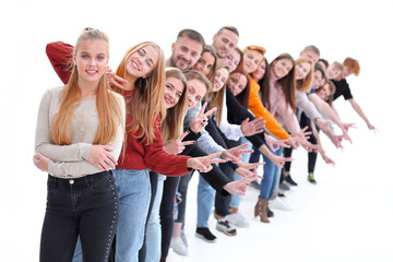 Obraz premium group of cheerful young people standing behind each other