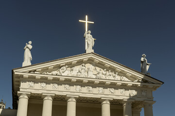 Fototapeta na wymiar VILNIUS, LITHUANIA - May 23, 2022: Cathedral Basilica of St Stanislaus and St Ladislaus on the Cathedral Square against the blue sky