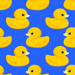 Yellow rubber duck. Seamless cute pattern with blue background for decorative textiles, modern fabrics. Vector.