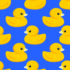 Yellow rubber duck. Seamless cute pattern with blue background for decorative textiles, modern fabrics. Vector.
