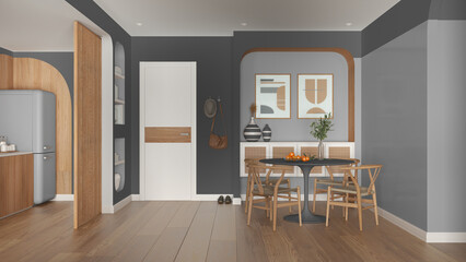 Contemporary dining room and kitchen in gray and wooden tones, round table with chairs, rattan commode, entrance door with cloth hanger. Parquet and decors. Modern interior design