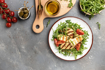vegeterian salad with fried halloumi and tomatoes, closeup, keto ketogenic diet. Delicious breakfast or snack, Clean eating, dieting, vegan food concept. top view