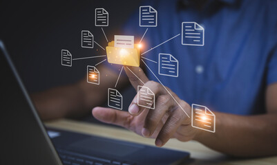 document management system concept Businessman pointing finger at folder and document software icon Searching and managing online document database files. for efficient archiving and company data