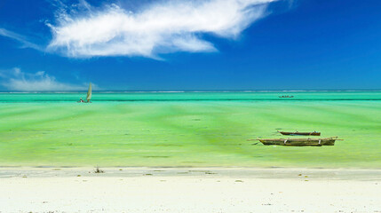 Beautiful tropical dreamlike empty beach landscape, bright white sand, green turquoise water, clear...