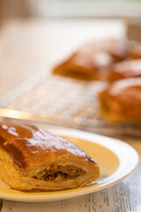 Sausage rolls or saucijzenbroodje a traditional Dutch savoury puff pastry with meat as a snack