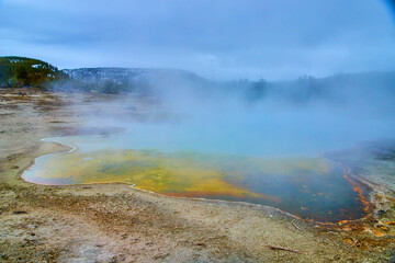 Biscuit Basin in Yellowstone with huge pools and sulfur steam