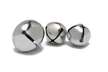 three different size silver bells white background