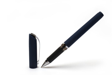 pointed pen next standing cap white background
