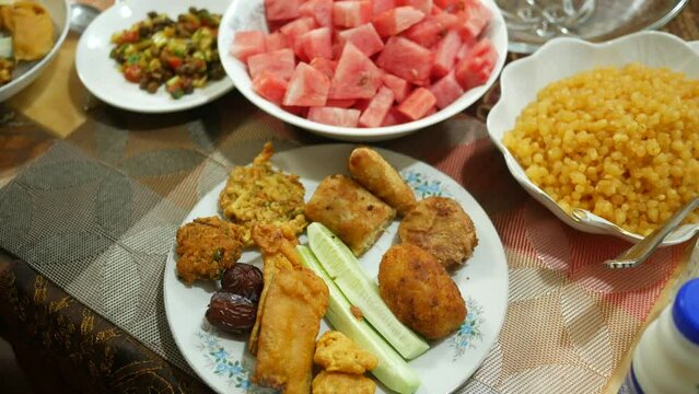 high angle view of iftar on plate on table during ramadan 