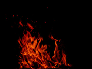 Abstract flame of fire from a campfire on a black background