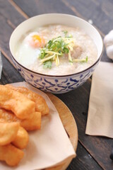 Congee in a Thai-patterned cup and fried dough are Thai food and street food popular to eat in the morning