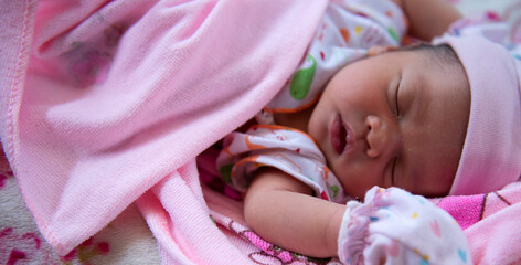 Baby Girl Sleep in Bed, Sleeping New Born Child on Pink Blanket.