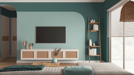 Modern wooden living room in turquoise tones, velvet sofa with table, rattan commode with...