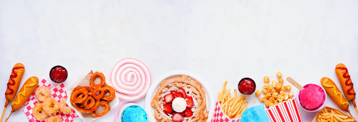 Carnival theme food bottom border on a white marble background. Top view with copy space. Summer...