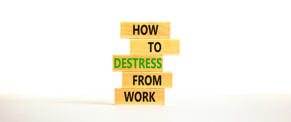 Destress from work symbol. Concept words How to destress from work on wooden blocks. Beautiful white table white background. Copy space. Psychological business destress from work concept. Copy space.