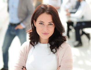 portrait of a young business woman on the background of the offi