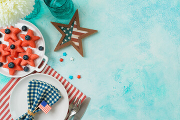 4th of July festive table setting  with summer fruit salad, plate and decorations. Happy...