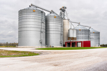 Large grain elevator in the countryside under cloudy sky in autumn