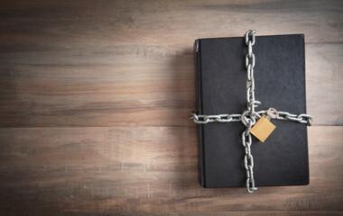 Book with chain and padlock. Information security - obrazy, fototapety, plakaty
