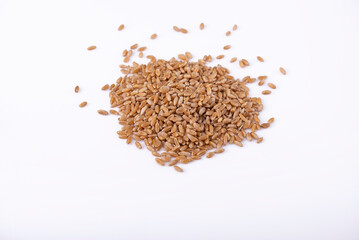 Top view of a heap of wheat on white table