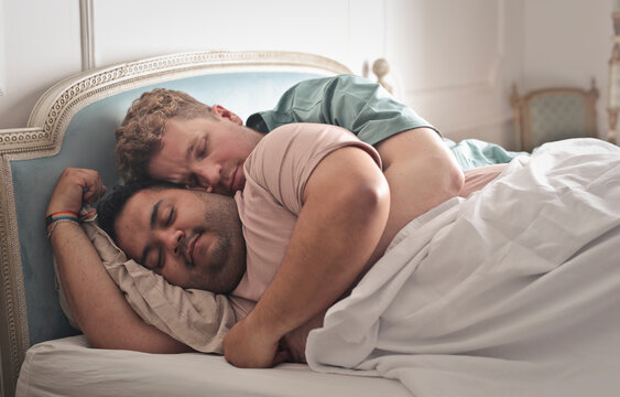 portrait of homosexual couple in bed