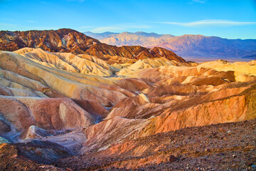Endless layers of colors in sediment of Death Valley desert mountains