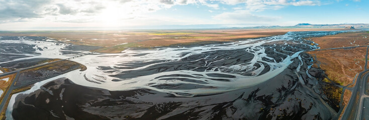 Beautiful Icelandic nature during summer time and sunny weather. Magical Iceland with green mountains, fields and waterfalls.
