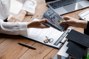 Home and Real Estate Selling Ideas, two people are real estate agents and a client is getting paid...