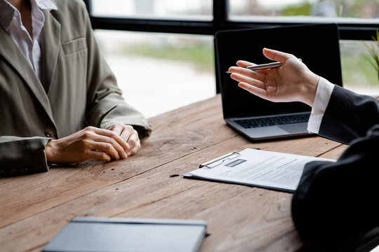 Person submitting resume to interview for a job with a company, Person attending a job interview with a manager to be recruited to the company for the position applied for. Job application concept.