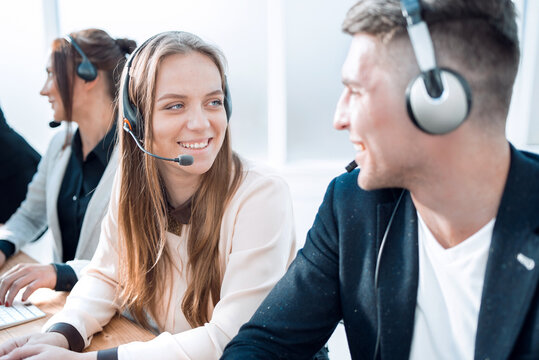 young call center colleagues looking at each other