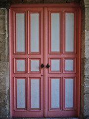 old pink wooden door of a house