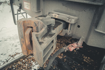 Coupler of a freight railway car. The mechanism of adhesion of train cars. Device for connecting trailers on the railway. Selective focus