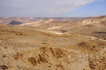 Fototapeta na wymiar beautiful desert relief hills, no plants, contrasting shadows, nature of Jordan