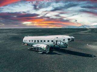 Aerial view of the old crashed plane abandoned on Solheimasandur beach near Vik in Iceland. Landscape with popular tourist attraction in Iceland. Exciting excursion to the sights view in winter