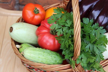 Basket with vegetables. Tomato, eggplant, cucumber, zucchini. Organic food.